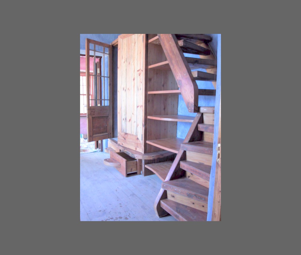 bedroom shelves and stairs to attic room 1